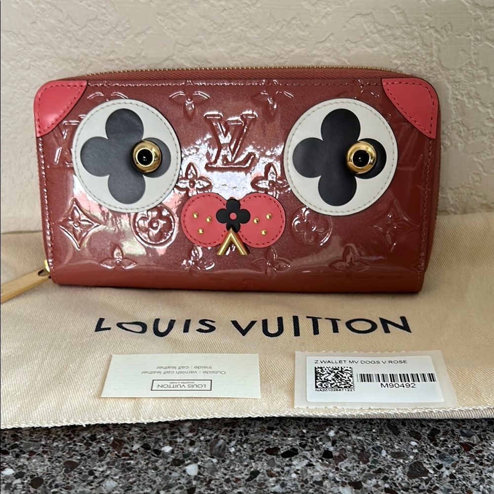 Louis Vuitton Rose Animal Face Wallet New with tags includes dust bag